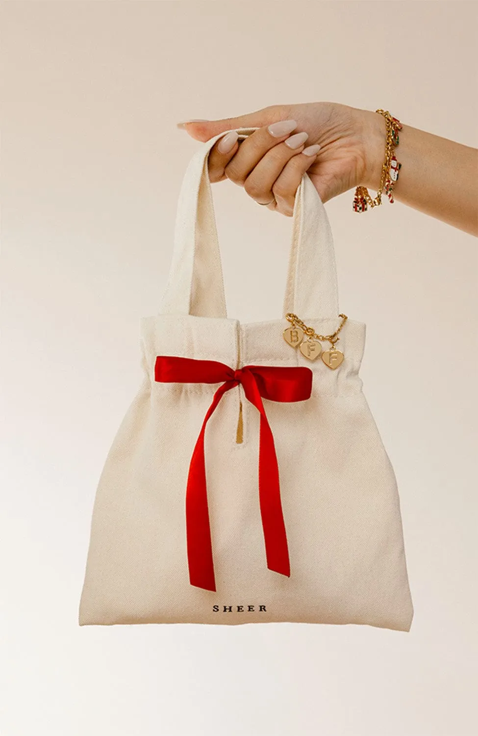 Holiday gift tote with 3 charms (free over $3000)